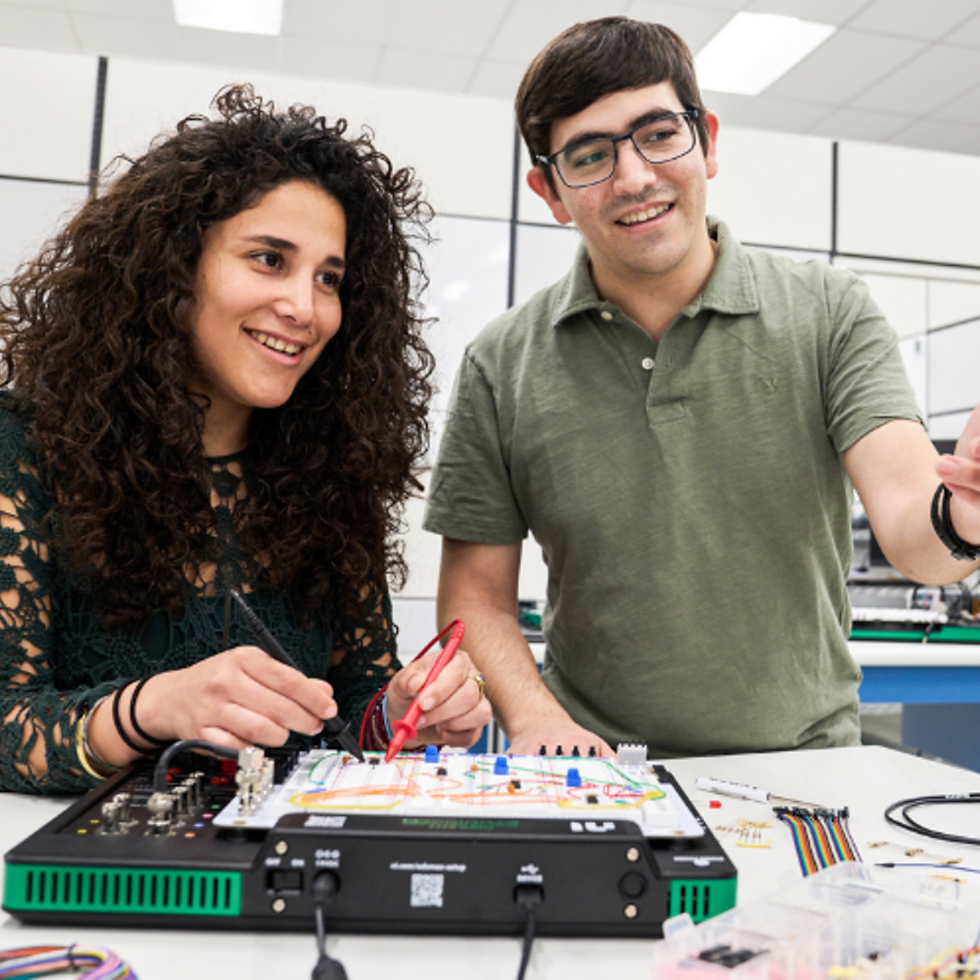 Two Engineering students working in a lab