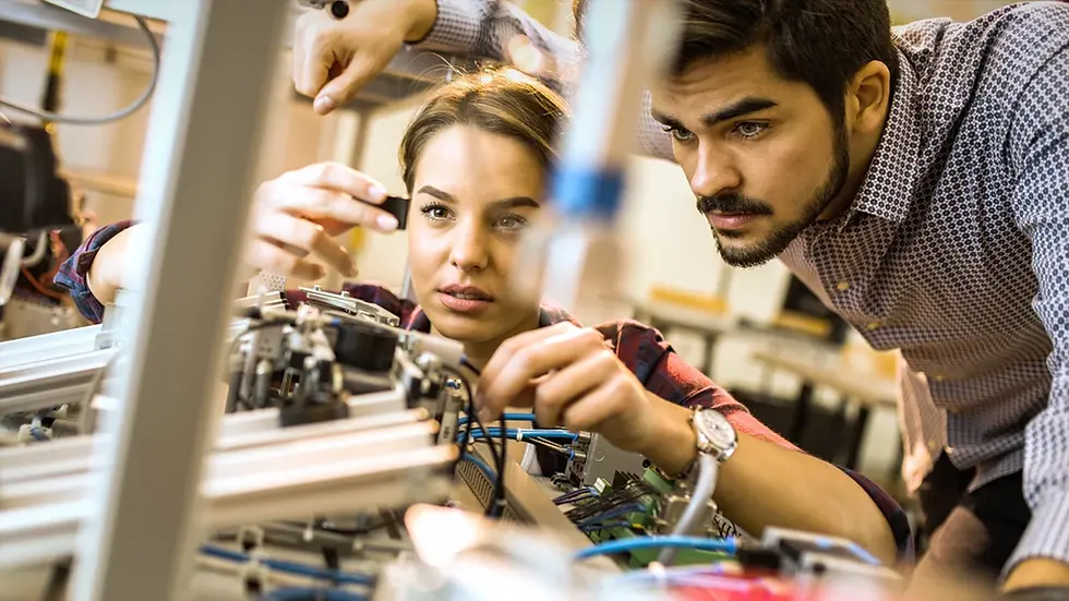 A student and a teacher working in a lab